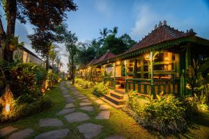 a building with a pathway in front of it at Juwel Villa Ubud in Ubud