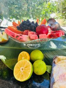 a glass plate of fruit on a table at Hotel Fazenda Haras Paraíso do Atlântico in Irecê