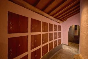 a room with wooden doors on a wall at Ibala Hotel & Spa in Nha Trang