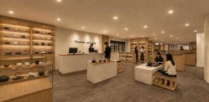 a store with people sitting at tables in a room at Potalaka Naksan Beach Wellness in Yangyang