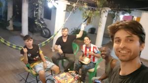 a group of men posing for a picture at Hostel Chaton in Asunción