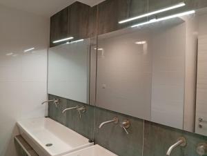 a bathroom with a sink and a mirror at Il Sassolino in Riomaggiore