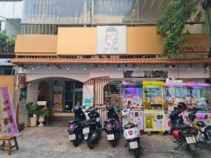 a group of motorcycles parked in front of a store at Myths Saigon in Ho Chi Minh City