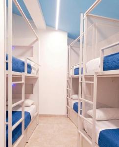 a room with four bunk beds in a room at Il Sassolino in Riomaggiore