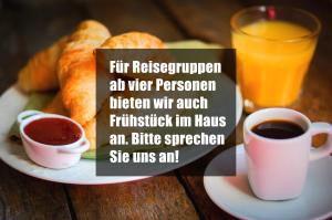 a plate of food with a cup of coffee and a glass of orange juice at Hirsch Hotel Hanau in Hanau am Main +11 photos