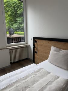 a bedroom with a bed and a large window at Blue Stay 2 in Bremen