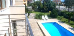 a swimming pool on the balcony of a building at Holiday Home in Gevgelija +5 photos