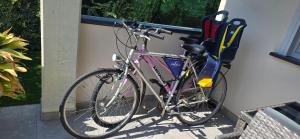 a bicycle is parked next to a wall at La Casetta al Lago in Sorico
