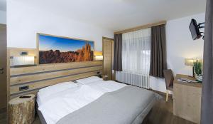Postel nebo postele na pokoji v ubytování Hotel Aida