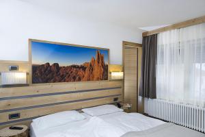 Postel nebo postele na pokoji v ubytování Hotel Aida