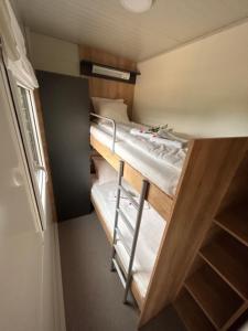 a small room with two bunk beds in it at Beach house Sofia in Otok Žut