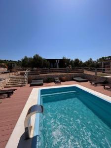 a swimming pool on top of a building at Beach house Sofia in Otok Žut