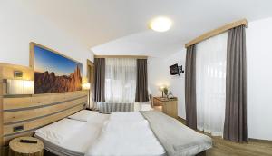 Postel nebo postele na pokoji v ubytování Hotel Aida