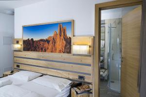 Postel nebo postele na pokoji v ubytování Hotel Aida