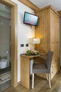 TV a/nebo společenská místnost v ubytování Hotel Aida