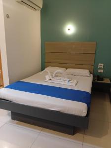 a bed in a room with at Nice Hotel in Manila