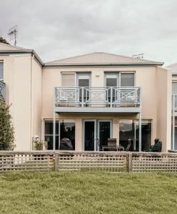 a house with a deck and a balcony at Moyne Views 2 in Port Fairy