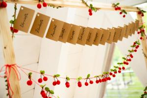 a christmas garland with red cherries and books at PiatrA Frame in Ştefeşti