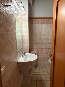 a bathroom with a sink and a toilet at La Sosta Nel Chianti in Castelnuovo Berardenga
