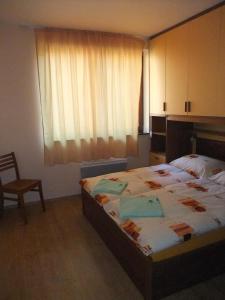 En eller flere senge i et værelse på Rodinny apartmán Slnečnica