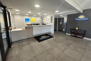 a lobby of adrugstore with adrugacistacistacistacist at Days Inn by Wyndham Atlanta Stone Mountain in Stone Mountain +40 photos