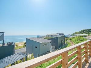 a view of the ocean from the balcony of a house at Awaji Dog Hill in Kusumoto