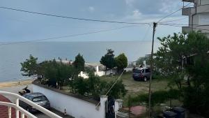 a view of the ocean from a balcony of a house at Hotel Zora by TM in Ravda +28 photos