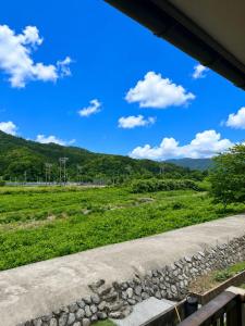 a view of a field from a highway at 鹿野寒舍館 in Tottori