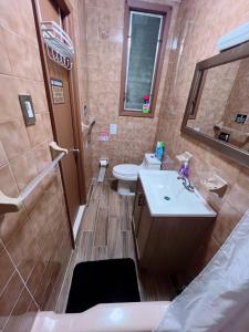 a bathroom with a sink and a toilet at Amazing private Room in Glendale