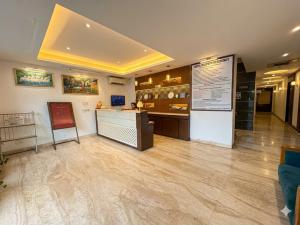 a large room with a counter and a counter at Hotel Rajpath Residency 2 Min Walk From Kaushambhi Metro Station in Ghaziabad