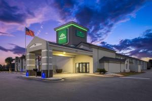 a gas station with an american flag in front of it at Wingate by Wyndham Myrtle Beach At Outlets in Myrtle Beach