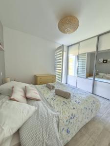 a bedroom with a large bed with two pillows on it at Justine's house in Alvignac in Alvignac