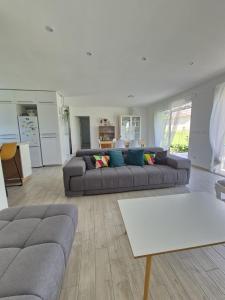 a living room with a couch and a table at Justine's house in Alvignac in Alvignac