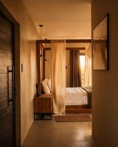 a bedroom with a bed and a large mirror at Sanyati Villa in Mmukubyane +25 photos