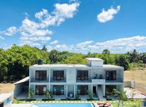 an aerial view of a house with a swimming pool at Surf Arugam in Arugam Bay
