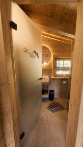 a metal door in a room with a table at Wieslhütte in Gerlosberg +48 photos