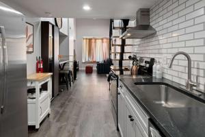 a kitchen with a sink and a counter top at Bright loft in Wheat Ridge in Wheat Ridge