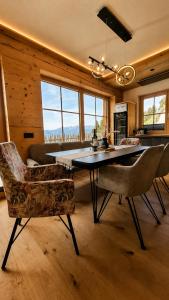 a dining room with a table and two chairs at Wieslhütte in Gerlosberg