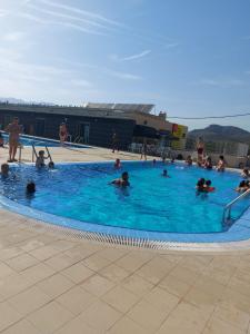 a group of people in a swimming pool at Casa de angil in Tivenys