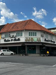 a building with a car parked in front of it at YY Residences in Ipoh