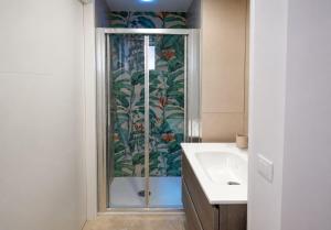 a bathroom with a shower and a sink at Dimora Azzurra in Pachino +3 photos