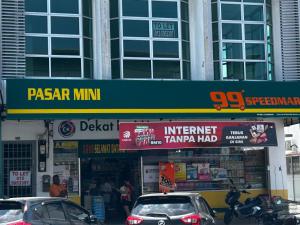 a gas station with cars parked in front of it at YY Residences in Ipoh