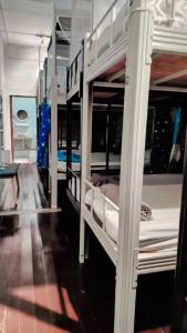 a room with two bunk beds in a room at Pirate's Cove in Malacca +12 photos