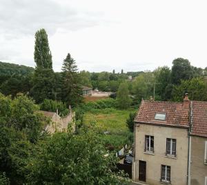 an aerial view of a village with houses and trees at 2-room apartment in Clamecy +2 photos
