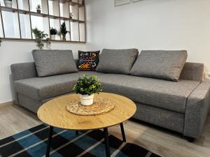 a living room with a couch and a table at Tsimiski Central Suites in Thessaloniki