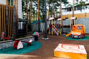 a playground with many different types of playground equipment at Altay Resort in Shchūchīnsk