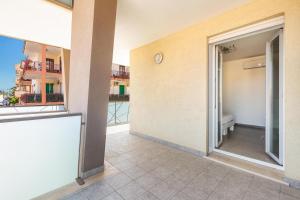 a balcony with a view of a building at B&B Acquamarina in Gallipoli