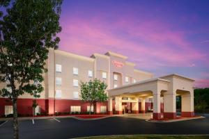 a rendering of a hotel building with a sunset at Hampton Inn Thomson in Thomson