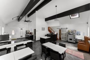 a living room with tables and chairs and a couch at Econo Lodge Inn & Suites Heavenly Village Area in South Lake Tahoe