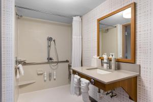 a bathroom with a sink and a shower at Hampton Inn Chicago-Gurnee in Gurnee +25 photos